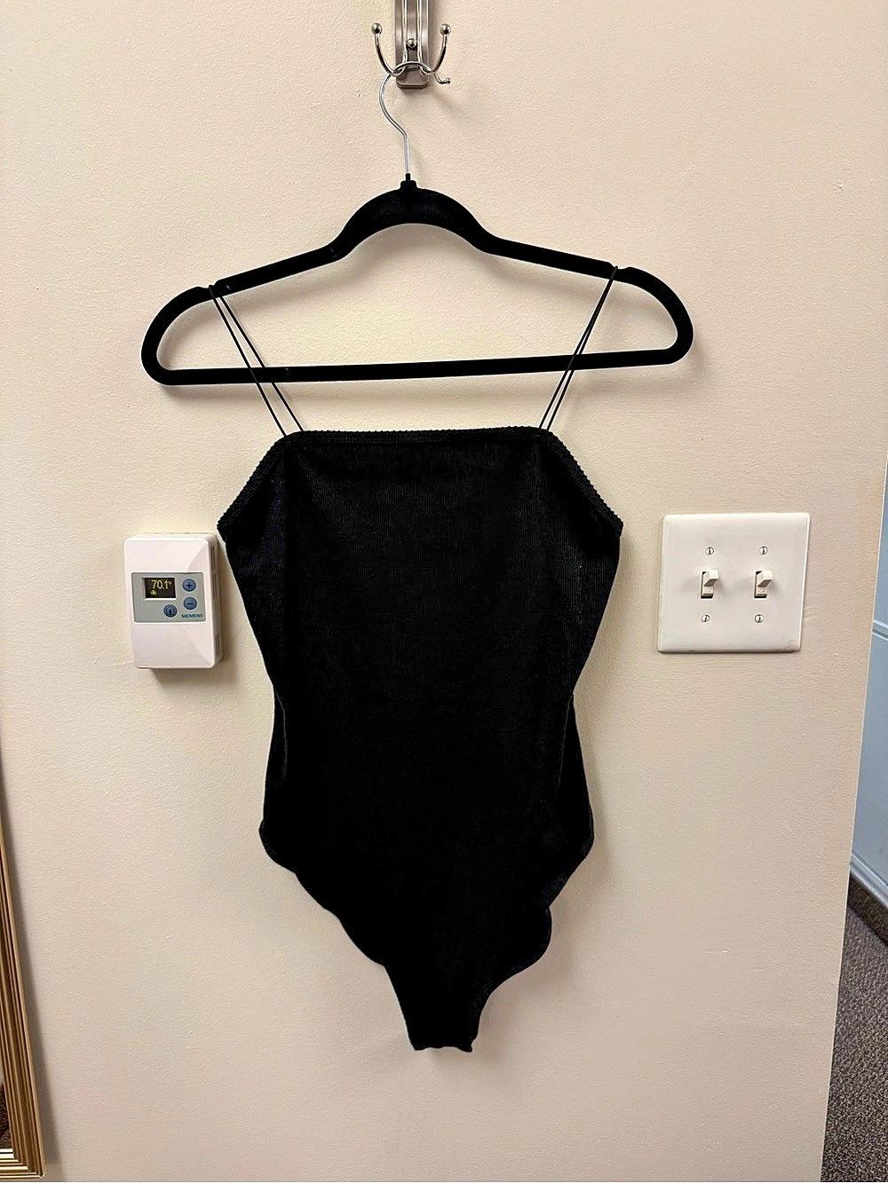 black bodysuit with thin straps